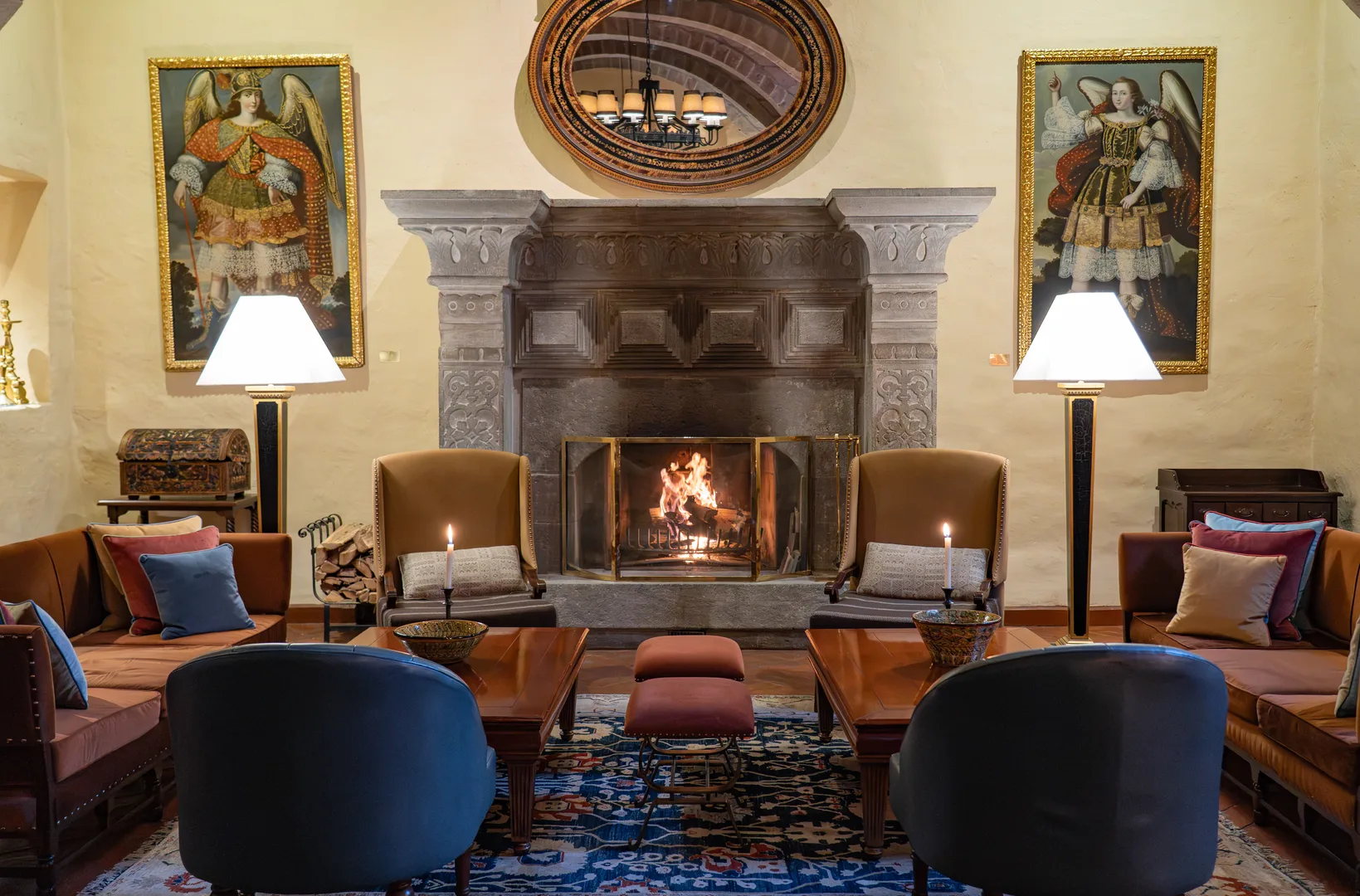 An elegant lounge with fireplace and classical artwork